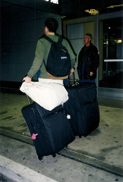 College student enters airport with suitcases to go to Carleton College for his freshman year. Photo by Barbara Falconer Newhall
