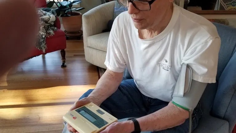 covid health man-taking-his-blood-pressure