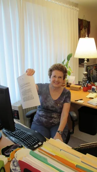 Barbara Falconer Newhall in her writing room with book contract. Photo by Jon Newhall
