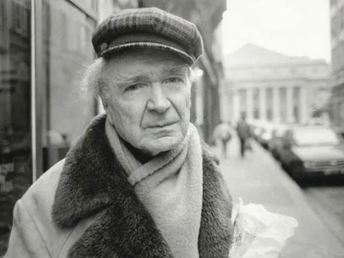 Emil Cioran in plaid cap and white hair.