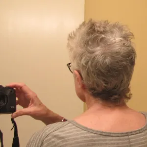 Author Barbara Falconer Newhall tries out her new hair with a navy outfit. Photo by Barbara Newhall