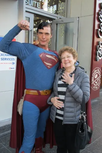 christopher-Dennis-and-barbara=newhall Actor Christopher Dennis poses in Superman outfit with writer Barbara Falconer Newhall. Photo by Jon Newhall