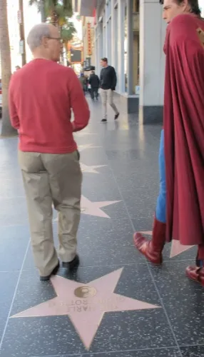 christopher-denis-and-jon-newhall Actor Christopher Dennis in Superman outfit strolls along the Hollywood Walk of Fame with Jon Newhall. Photo by BF Newhall