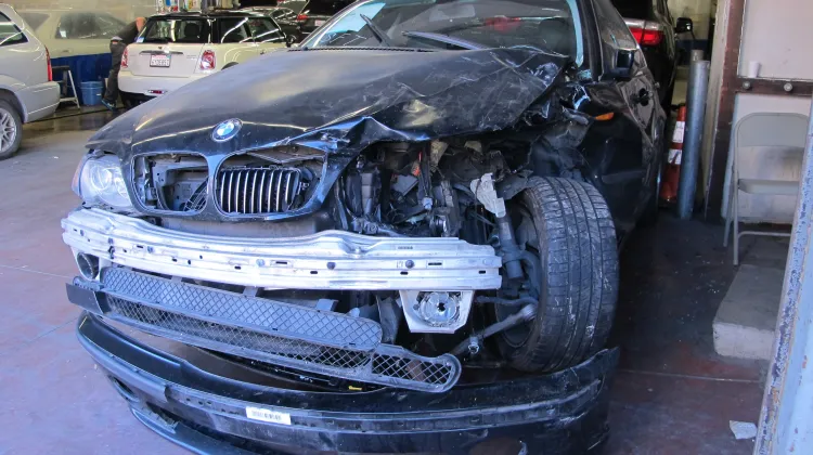 I'm going to stop bad-mouthing Donald Trump. Even though my world feels like this crashed car awaiting body work at a shop in San Francisco. Photo by Barbara Newhall