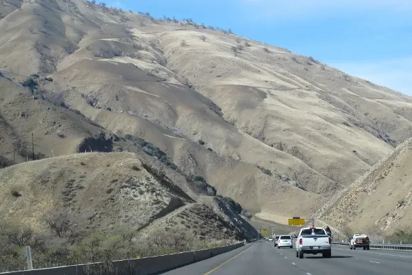 The hills of southern California on the Grapevine near Gorman are grey from drought. Photo by BF Newhall