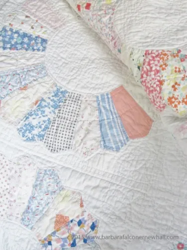 A quilt made with grain sacks following the dresden plate pattern made in the 1940s in Scottville, Michigan. Photo by Barbara Newhall