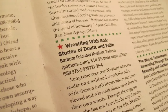 Author Barbara Falconer Newhall opens her copy of Publishers Weekly magazine, which had  just arrived in the mail, to find that her book, Wrestling with God, got a starred review in the January 21, 2015, issue. PHoto by Jon Newhall