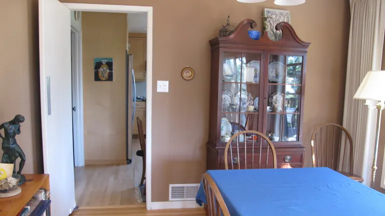 Too many walls? To create an open concept living space, the homeowners could take down this wall between the dining room and kitchen. Photo by Barbara Newhall