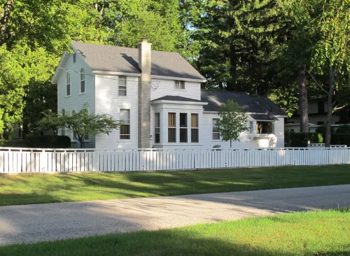 a white fram huse in Pentwater Michigan. Photo by Barbara Newhall