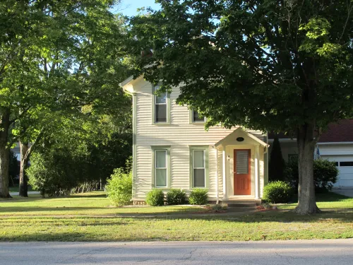 One of the many beautiful 19th century frame houses that adorn the streets of Pentwater Michigan. Photo by Barbara Newhall