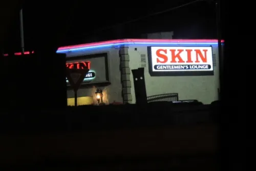 a sign in los angeles advertising "Skin, A Gentleman's Lounge." Photo by BF Newhall