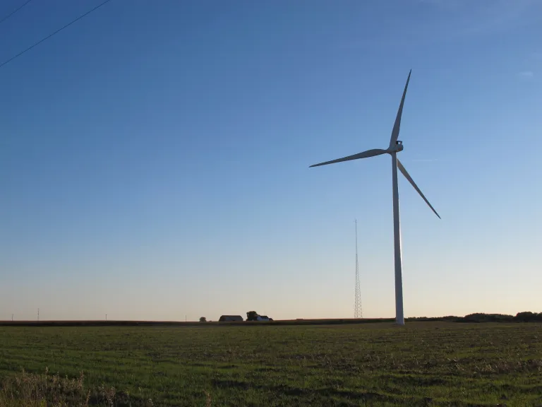 Windmills outlined against the sky of Mason county, Michigan, farmland. Photo by Barbara Newhall