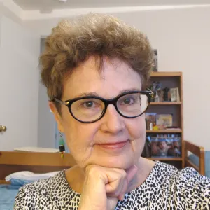 Author Barbara Falconer Newhall takes a photo of herself wearing dark, statement glasses before cataract surgery and insertion of an IOL. Photo by Barbara Newhall