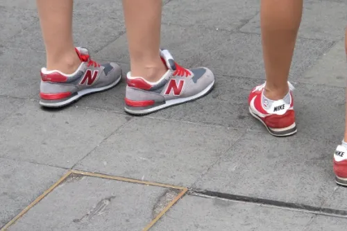 bare legged women in shanghai wear new balance and nike sneakers. Photo by bf newhall