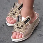 bunny-shoes-china beige and black sequined mules with a rabbit face on a girl in Shanghai. Photo by BF Newhall