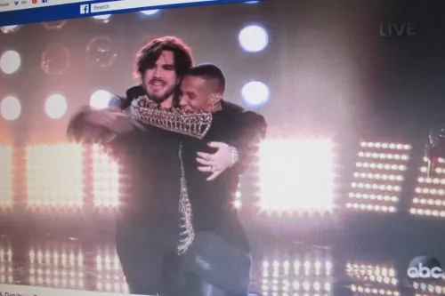 hugging adam-lambert-dimitrius-graham-hug
