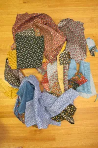 Vintage calico scraps from the 1970s in bold primary colors await sewing into a crazy quilt. Photo by Barbara Newhall