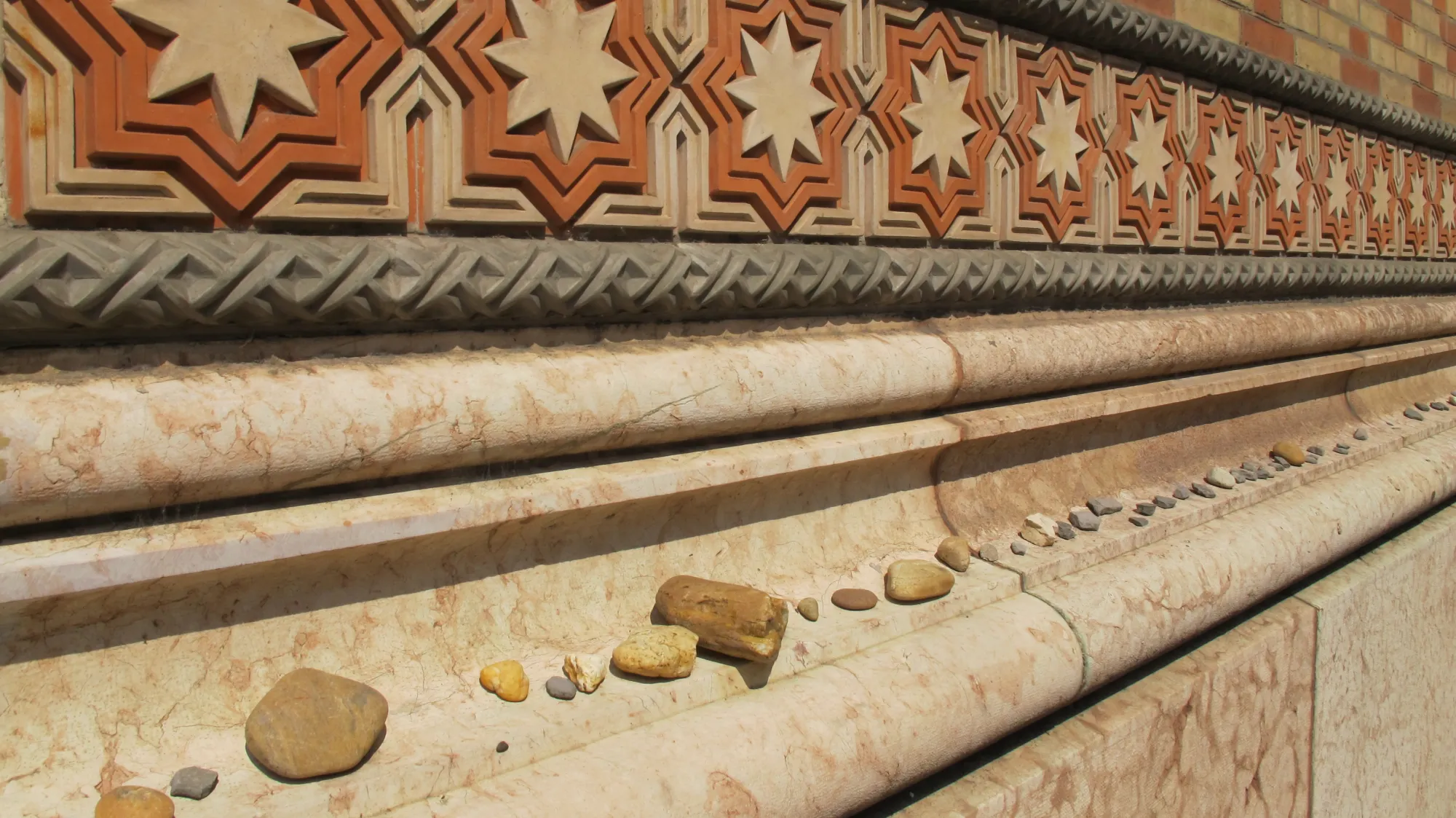 Stones left on the wall of the Dohany Street Synagogue, Budapest, in memory of Jews lost in the Shoah. Photo by Barbara Newhall