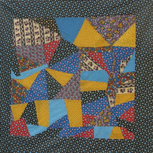 Quilt piecings made of flowered calico in primary colors and black dating to the 1970s. Assembled in the Berkeley, California, quilting studio of Sue Mary Fox. Photo by Barbara Newhall