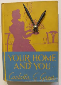 Jim Rosenau. Single book wall clock. $95. Art from vintage books. Berkeley Artisans Holiday Open Studios Dec 2015. Photo by Barbara Newhall