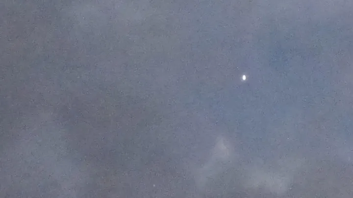 A totality disappointment: A "star." probably Venus, appeared through a break in the clouds during the 2017 total solar eclipse in St. Joseph, MO. Photo by Barbara Newhall