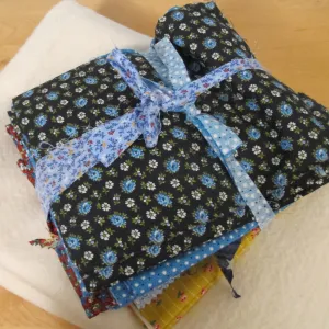 Vintage 1970s flowered calico in primary colors in a bundle. Photo by Barbara Newhall