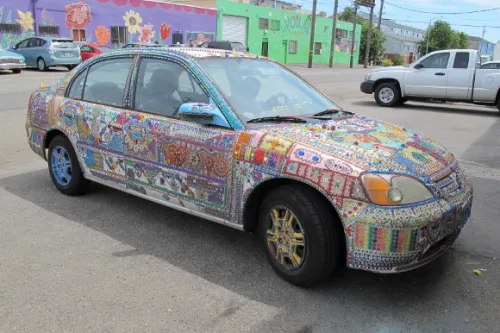 mosaic-car a car entirely covered with mosaics parked in Oakland, CA, Jingletown neighborhood. Photo by BF Newhall