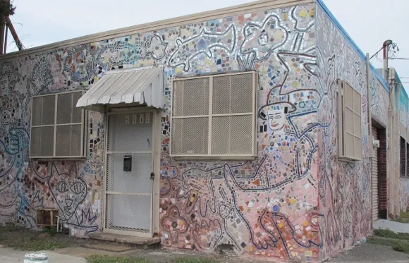 jingletown-mosaic-house A building in Jingletown district of Oakland, CA, is covered with pastel tesserae mosaics of animals and people. Photo by BF Newhall