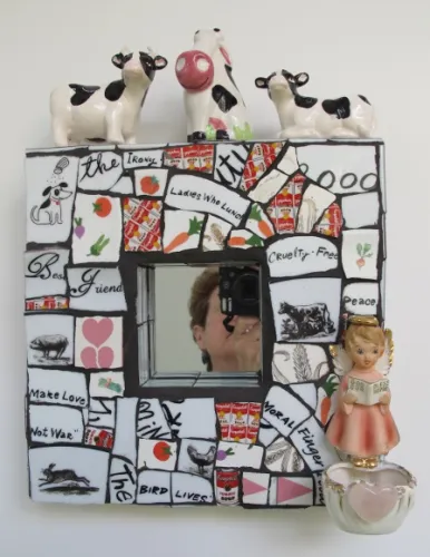 Marcy-Schaff "Holy Cow" a mosaic with ceramic tiles and cow & angel figurines by Marcy Schaff, $155, at the Institute of Mosaic Art. Photo by BF Newhall http://BarbaraFalconerNewhall,com