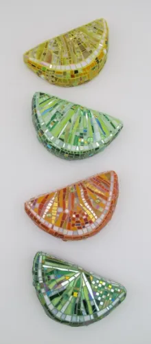 Kim-Larson-mosaic Four 3-dimensional mosaics of slices of citrus fruit hang on wall. "Lemon Lime Orange Lime" by Kim Larson, $200 each at the institute of mosaic art, berkeley. Photo by BF Newhall