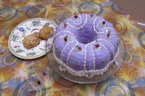 mosaic-bundt-cake A lavendar mosaic bundt cake on a table alongside a plate of cookies at the Institute of Mosaic Art, Berkeley, CA. Photo by BF Newhall