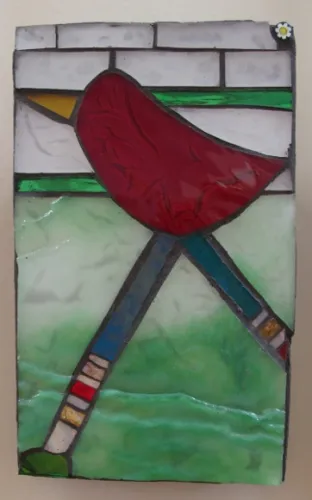 mosaic-redbird a small mosaic with red bird and green background at Institute of Mosaic Art. Photo by BF Newhall