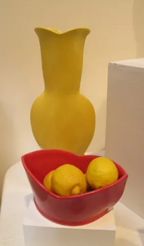 At the  Berkeley Potters Guild, Berkeley, CA, ceramics by Sarah Gregory: A yellow vase,  and a red bowl8. Photo by BF Newhall