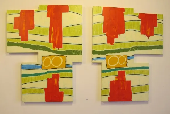 An abstract painting by Berkeley painter Judy Seidel is red, blue and yellow with red buttons. Photo by BF Newhall