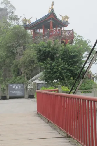 Boardwalk bridge with red railings approaching the Shibaozhai Temple on the Yangtze River. Photo by BF Newhall