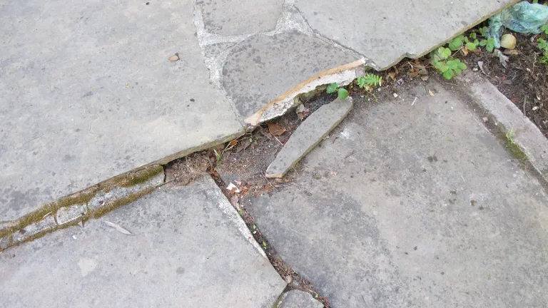 shabby old patio with sinking-patio-flagstones