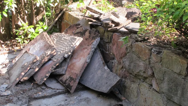 Salvaging-Arizona-sandstone-flagstones in a shabby old patio