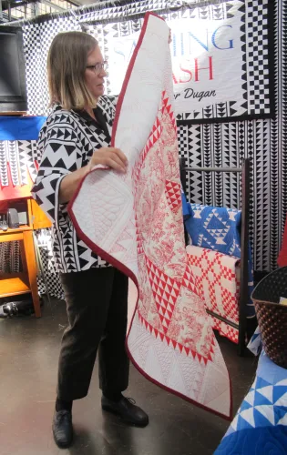 vENDOR SASHING STASH showed fabric at East Bay Heritgage Quilters show "Voices in Cloth 2016" in richmond, CA Eleanor Dugan is the proprietor. Photo by Barbara Newhall