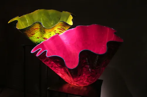 Two vessels with scalopped edges-- one chartreuse, the other cerise -- in Dale Chihuly's "Macchia Forest" at the Chihuly Garden and Glass in Seattle. Photo by Barbara Newhall