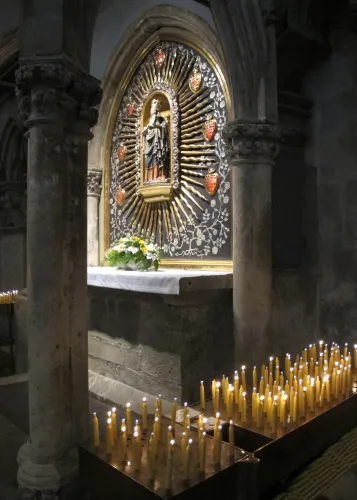 Candles before the statue of Mary and Baby Jesus in the Regensburg cathedral, Germany. Photo by Barbara Newhall