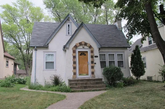 A grey-green Tudor bungalow in Minneapolis. Photo by Barbara Newhall     A grey-green Tudor bungalow in Minneapolis. Photo by Barbara Newhall
