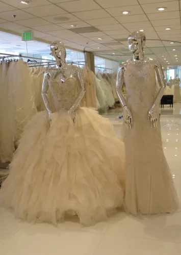 Wedding dress shopping: a frothy gown and a slinky one. Photo by Barbara Newhall