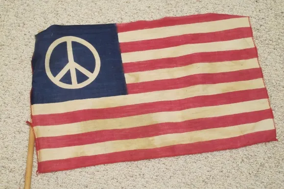'tis the season to declutter this 1960s-peace-flag 