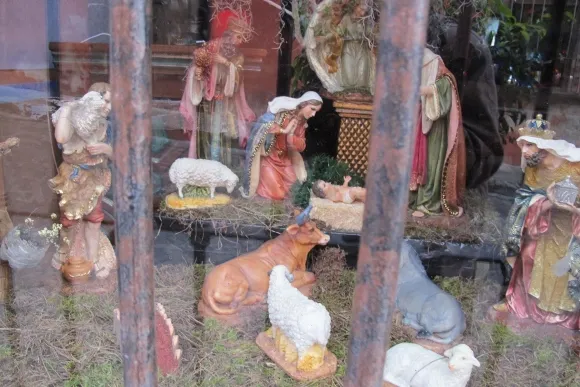 Nativity scene in a San Miguel de Allende, Mexico, shop window with Baby Jesus, Mary and other figurines. Photo by Barbara Newhall