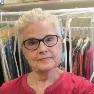 Barbara Falconer Newhall in her new white hair tries it out with a dark red shirt. Photo by Barbara Newhall