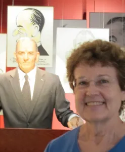 Writer Barbara Falconer Newhall poses in front of the LBJ automatron at the LBJ library and museum in Austin, TX. bf newhall photo