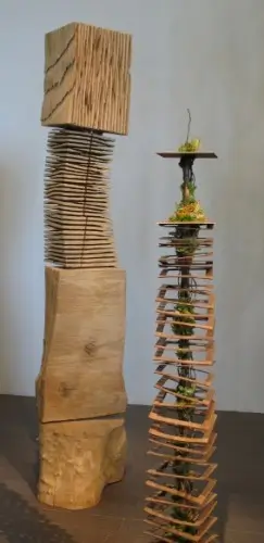 Patricia Gillespie of Sharpstick Studio created a tall floral arrangment to echo David Nash's wood sculpture Rip and Cross Cut Block Column, 2002. Photo by BF Newhall