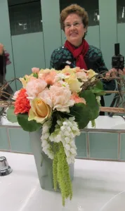 Writer & Photographer barbara falconer newhall at the de Young museum san francisco with a Bouquets to Art bouquet, March 2013. Photo by BF Newhall.