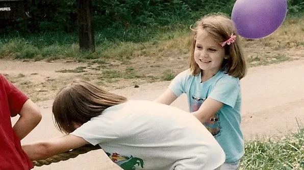 At age 7, Christina preferred a tug of war to playing with her Bride Barbie. Photo by Barbara Newhall
