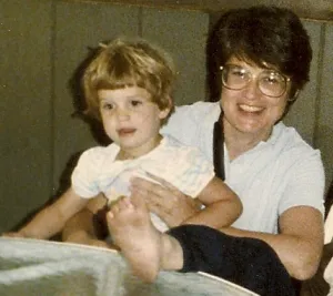 Barbara Falconer Newhall with 3-year-old daughter in her lap. Photo by Karel Howse.